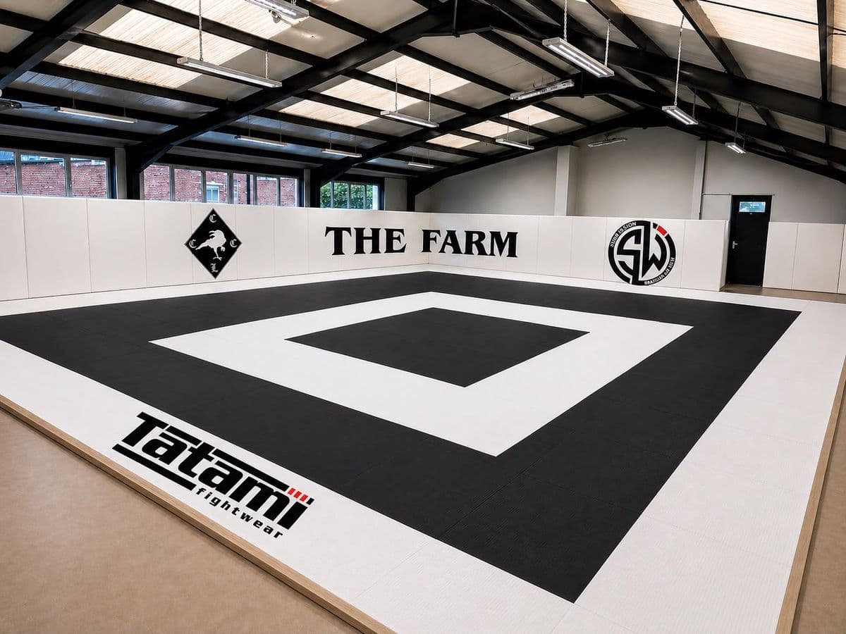 The mat room with the SWBJJ emblem and the raven on the wall